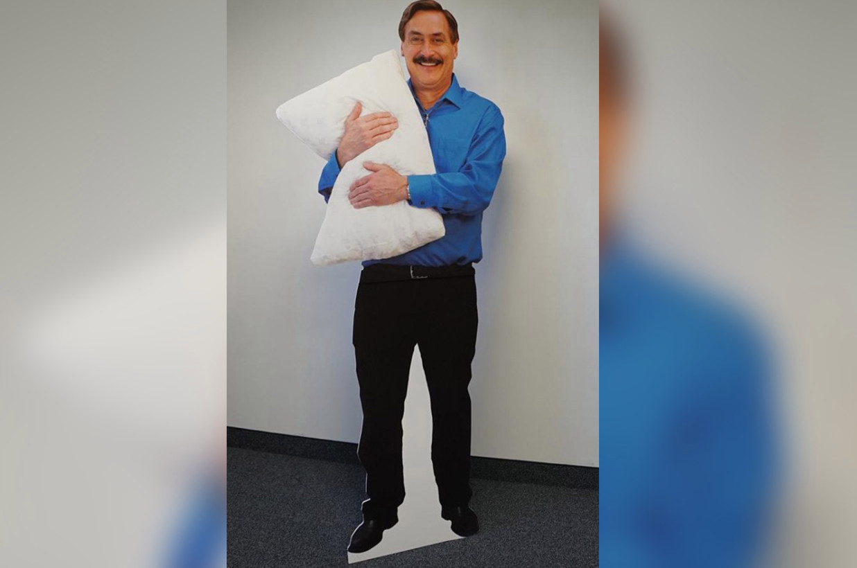 man hugging body pillow